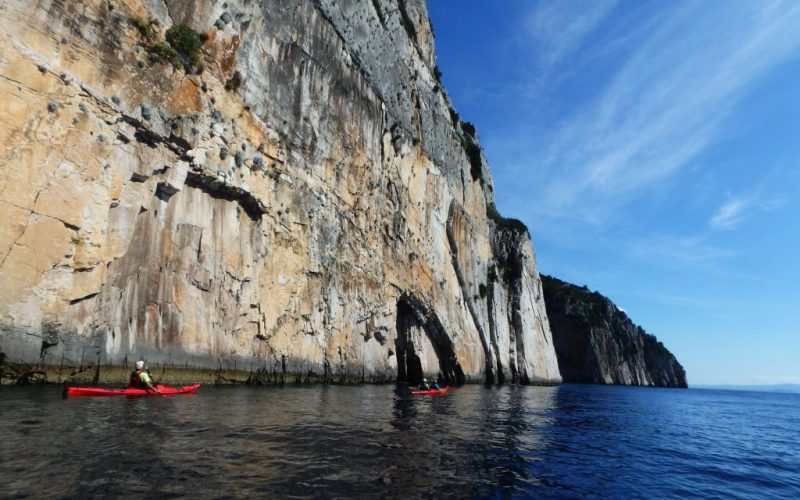 Impressive cliffs on south shore of Solta island - Island hopping sea kayak Croatia - Red Adventures